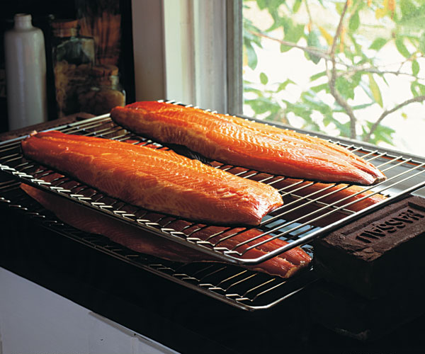 After the long smoking, the salmon rests. Elevate the racks to allow air to circulate.
